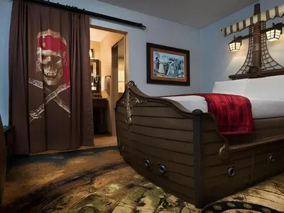 a bedroom with a large bed in a room at Disney's Caribbean Beach Resort in Orlando