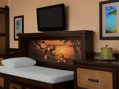 a room with a tv on top of a fish tank at Disney's Caribbean Beach Resort in Orlando