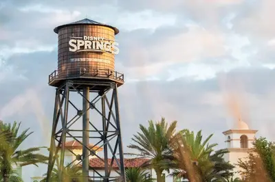 a water tower with the words dance springs on it at Disney's Port Orleans Resort - French Quarter in Orlando