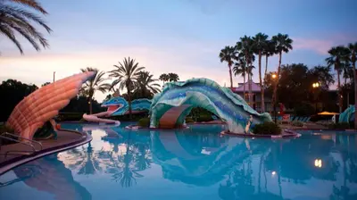 a pool with a water slide in a resort at Disney's Port Orleans Resort - French Quarter in Orlando