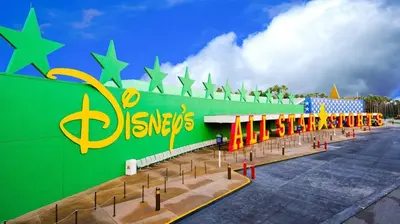 a building with a green wall with stars on it at Disney's All-Star Sports Resort in Orlando
