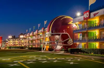 a large building with a building with a large wheel on it at Disney's All-Star Sports Resort in Orlando