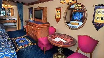 a bedroom with a vanity and a table and a mirror at Disney's Port Orleans Resort - Riverside in Orlando
