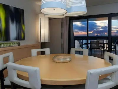 a dining room with a wooden table and chairs at Disney's Contemporary Resort in Orlando