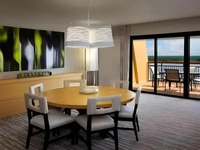 a dining room with a table and chairs at Disney's Contemporary Resort in Orlando
