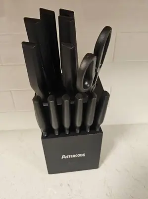 a black container filled with utensils on a counter at Foodie Lovers Walkable Mills50 - Sleeps 10 - Near Airport in Orlando