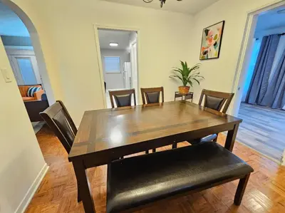 a dining room with a wooden table and chairs at Foodie Lovers Walkable Mills50 - Sleeps 10 - Near Airport in Orlando