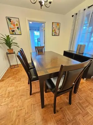 a dining room with a wooden table and chairs at Foodie Lovers Walkable Mills50 - Sleeps 10 - Near Airport in Orlando