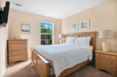 a bedroom with a large bed and a window at Relaxing Getaway in Emerald Island Near Disney in Kissimmee