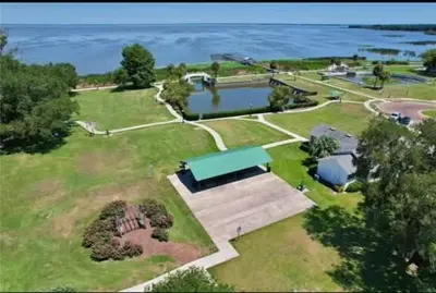 an aerial view of a park with a lake at StylishAptWtrGrdnOppLake&Prk&Yrd in Orlando