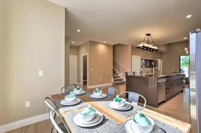 a dining room and kitchen with a table and chairs at Luxury Magic Village 2mi to Disney TH7501 in Orlando