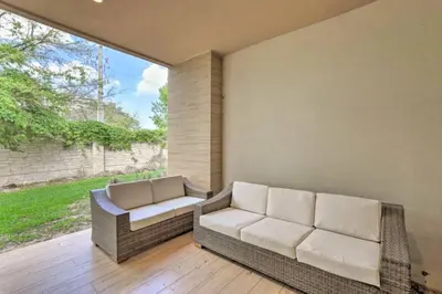 a patio with two chairs and a couch at Luxury Magic Village 2mi to Disney TH7501 in Orlando