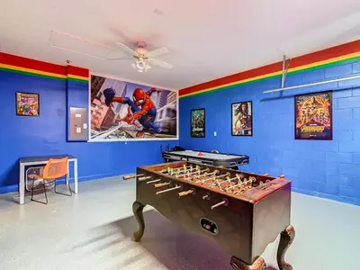 a room with a foosball table in the middle at T8134-Windsor Palms Resort Pool and Spa Near Disney in Kissimmee