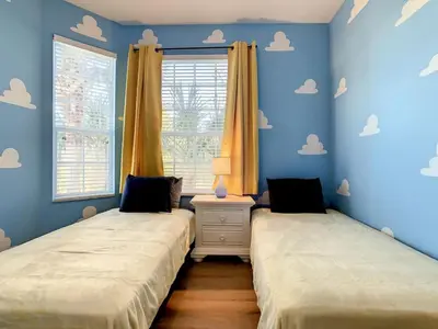 two beds in a room with blue walls at C2785-203-Windsor Hills Resort Free Water Park Themed Rooms in Orlando