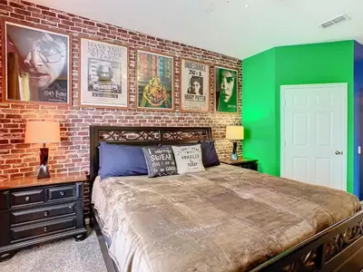 a bedroom with a brick wall and a bed at C2821-403-Windsor Hills Resort-Free Water Park-2 Miles to Disney in Orlando