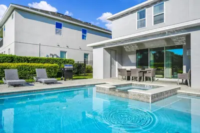 a swimming pool in front of a house at Regal Home With Private Pool Near Disney With Waterpark & Resort Access At Encore Resort - 7727Ff in Kissimmee