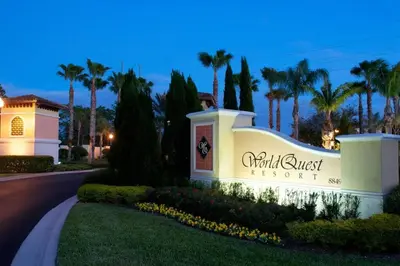 a sign for the front of a resort with palm trees at Luxurious & Epic Condo in heart of Orlando in Orlando