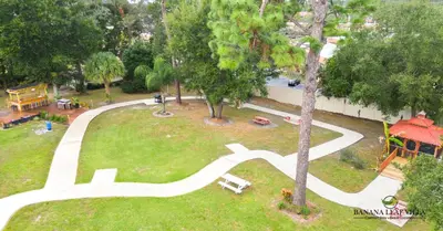 an aerial view of a park with a road at Banana Leaf Villa in Orlando
