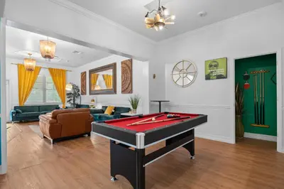 a living room with a pool table in it at Banana Leaf Villa in Orlando