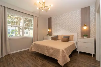 a bedroom with a bed and a window at Magical Themed 3BR Townhouse Near the Parks in Kissimmee
