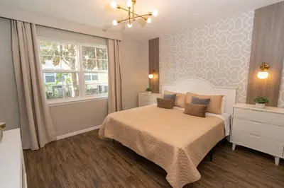 a bedroom with a bed and a window at Magical Themed 3BR Townhouse Near the Parks in Kissimmee