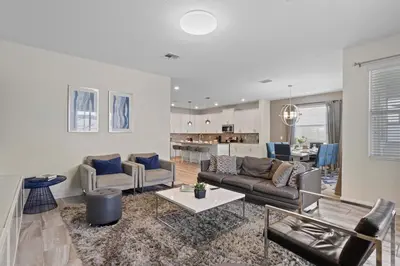 a living room with a couch and a table at 4718 Sleepy Hollow Drive in Kissimmee
