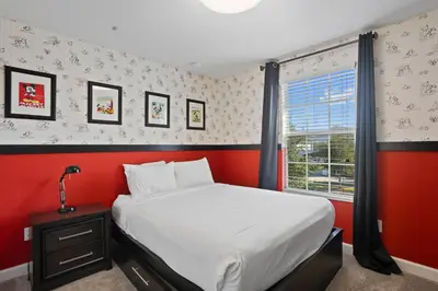 a bedroom with a large bed and a window at 4718 Sleepy Hollow Drive in Kissimmee