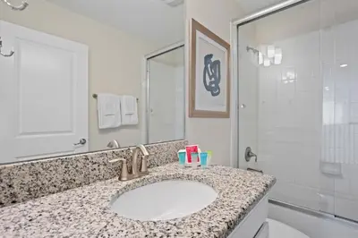 a bathroom with a sink and a shower at 4718 Sleepy Hollow Drive in Kissimmee