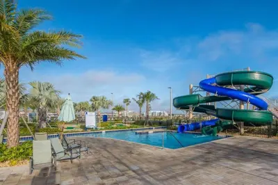 a water slide in a resort with a pool at 4 BD 3 BA Private Pool Storey Lake 4832 in Kissimmee