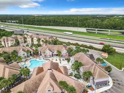 an aerial view of a home with a swimming pool at Be Our Guest! 1 Bedroom Condo Near Disney Parks! in Orlando