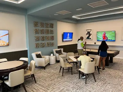 a group of people standing in a waiting room at Enchanted Orlando Getaway, 10 minutes from Disney in Kissimmee