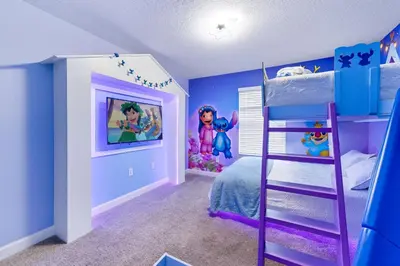 a bedroom with a bunk bed and a purple room at Disney Getaway Prime Location Themed Rooms in Kissimmee