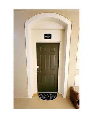 a green door in a hallway with a sign above it at 2778 Windsor Hills 3 Bed Condo- All Included in Orlando