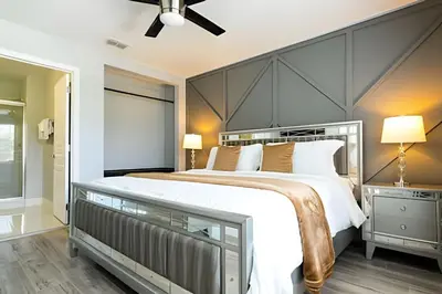 a bedroom with a large bed with a large headboard at 6BD/4BA Windsor Hills | Sala de Jogos & Piscina in Orlando