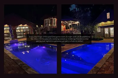 a swimming pool at night with blue lights at Lake House in Orlando