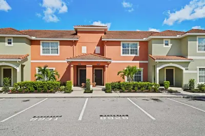a large building with a parking lot at 8929 Candy Palm Road in Kissimmee