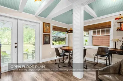 an open floor plan with a table and chairs in a room at Mills Lakeside in Orlando