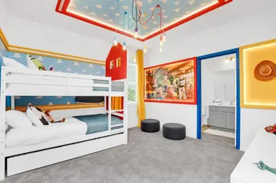 a kids bedroom with a bunk bed and a bathroom at Dynamic 15 Bed With Character Bedrooms Pool, Spa! villa in Kissimmee