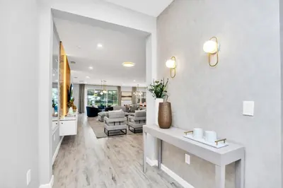 a living room with a table and a couch at Dynamic 15 Bed With Character Bedrooms Pool, Spa! villa in Kissimmee