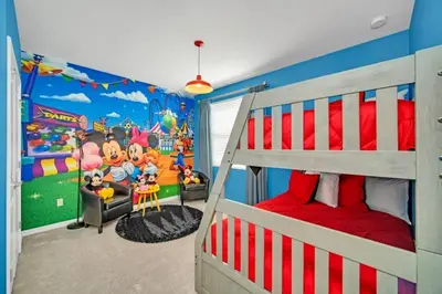 a bedroom with a toy story mural on the wall at 4741Clock Unit208 townhouse in Kissimmee