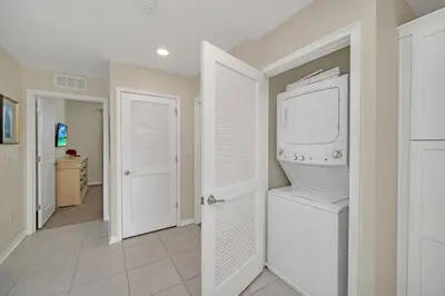 a laundry room with a washer and dryer at 4741Clock Unit208 townhouse in Kissimmee