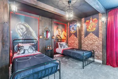 a bedroom with two beds and a brick wall at 4552Target home in Kissimmee