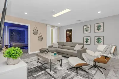 a living room with a couch and a table at 4552Target home in Kissimmee