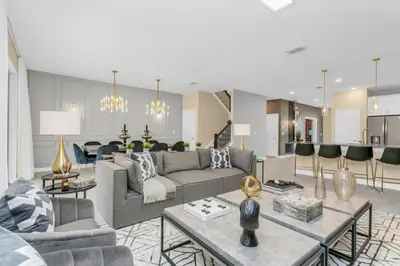 a living room with a couch and a table at 4552Target home in Kissimmee
