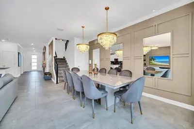 a dining room with a table and chairs at 2900Penolpe home in Kissimmee