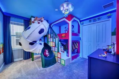 a childs room with a play room with a slide at 2900Penolpe home in Kissimmee