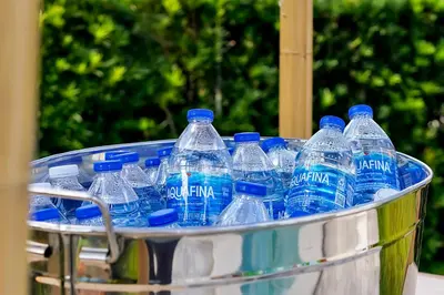 a bucket full of bottles of water in a container at 5BD Moana-Themed - Movie by the Pool - Near Disney in Orlando