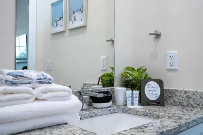 a bathroom with a sink and towels on a counter at RCT Dreamstay in Orlando