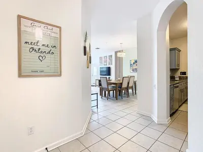 a kitchen and dining room with a sign on the wall at Windsor Hills Cozy 3 BR Condo, Starwars, By Disney in Orlando