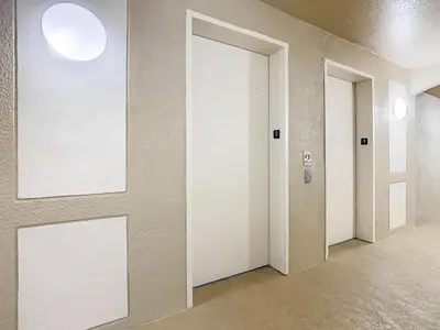 an empty hallway with three doors in a building at Windsor Hills Cozy 3 BR Condo, Starwars, By Disney in Orlando
